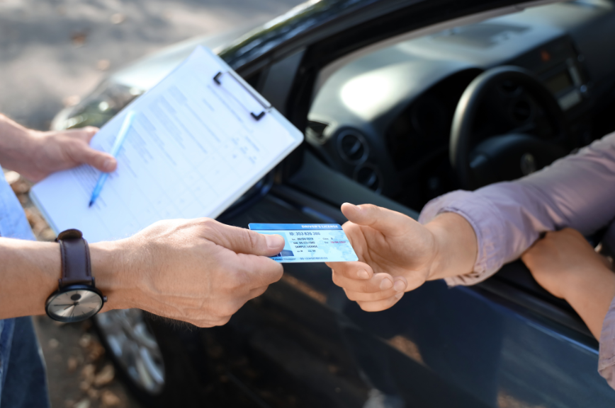 handing over full driving licence after passing at Mitcham driving test centre